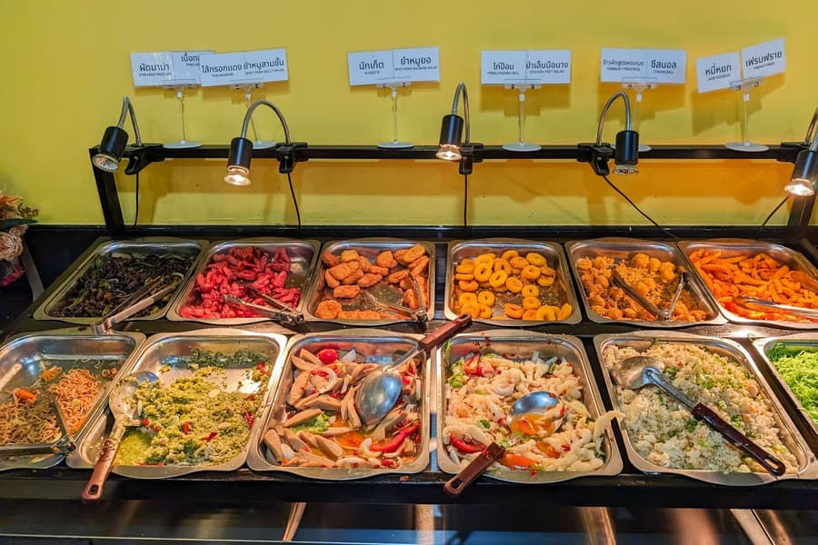 An electric warming tray on a serving counter