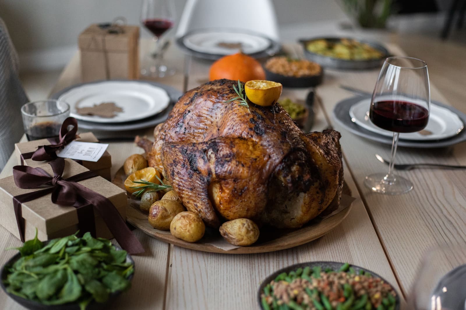 A roasted turkey resting on a table after cooking